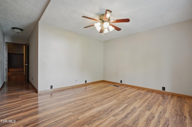 11316 Boggs Hollow Rd, Pound, VA 24279 - unfurnished room featuring wood finished floors, ceiling fan, a textured ceiling, and baseboards
