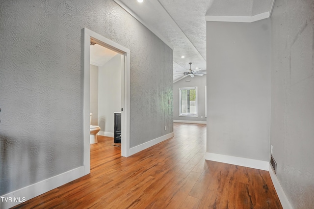 11316 Boggs Hollow Rd, Pound, VA 24279 - corridor with wood finished floors, baseboards, a textured wall, recessed lighting, and lofted ceiling