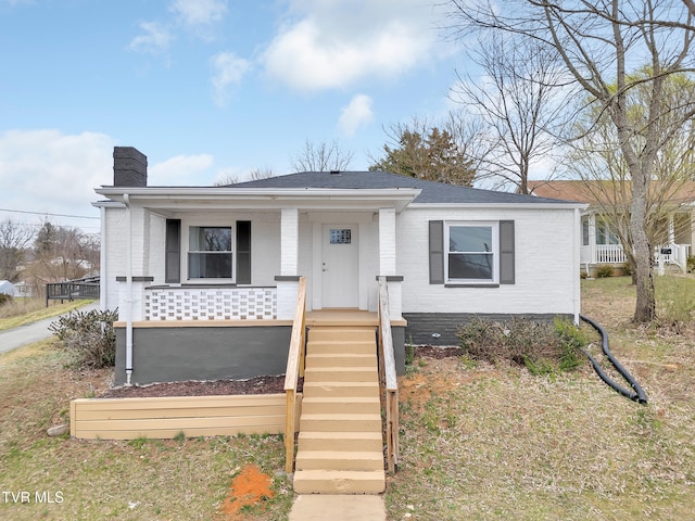 1241 Virginia Ave, Bristol, TN 37620 - view of front of property with a chimney, roof with shingles, covered porch, and brick siding