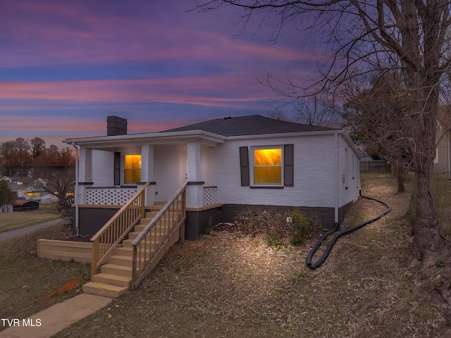 1241 Virginia Ave, Bristol, TN 37620 - view of front of home with a chimney, covered porch, and a shingled roof