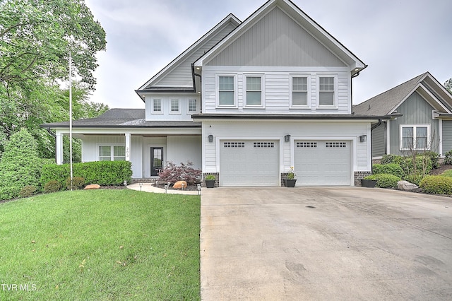 203 Riverwatch Cir, Kingsport, TN 37660 - view of front of house featuring a garage, a front lawn, driveway, and covered porch