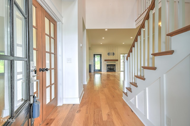 203 Riverwatch Cir, Kingsport, TN 37660 - entrance foyer with a fireplace, light wood-style flooring, stairs, french doors, and baseboards