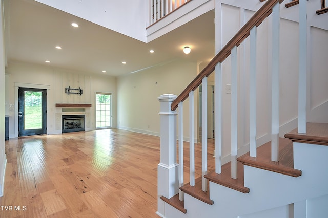 203 Riverwatch Cir, Kingsport, TN 37660 - staircase with wood finished floors, recessed lighting, a fireplace, and baseboards
