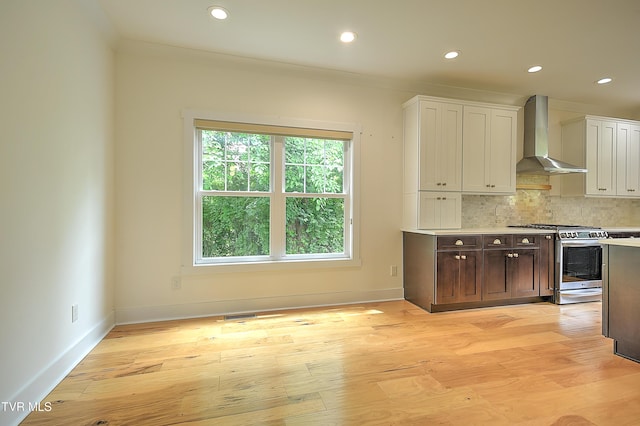 203 Riverwatch Cir, Kingsport, TN 37660 - kitchen featuring stainless steel gas range, wall chimney exhaust hood, light wood-style flooring, backsplash, and recessed lighting