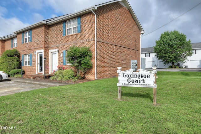 24 Lexington Ct Unit 6, Johnson City, TN 37615 - view of front facade featuring brick siding and a front yard
