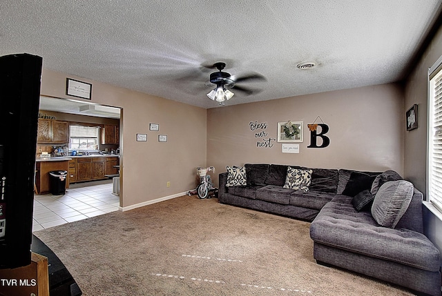 24 Lexington Ct Unit 6, Johnson City, TN 37615 - living area featuring light carpet, a ceiling fan, light tile patterned flooring, a textured ceiling, and baseboards