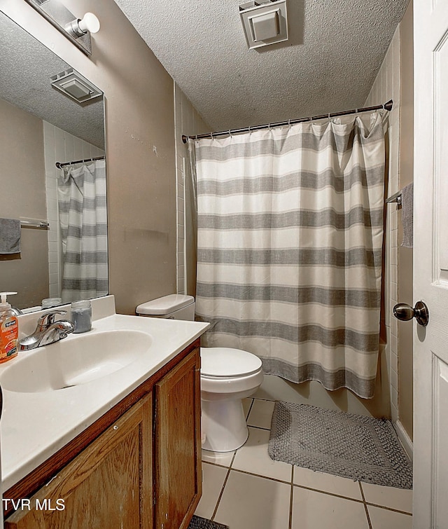 24 Lexington Ct Unit 6, Johnson City, TN 37615 - bathroom with a textured ceiling, tile patterned floors, vanity, toilet, and curtained shower