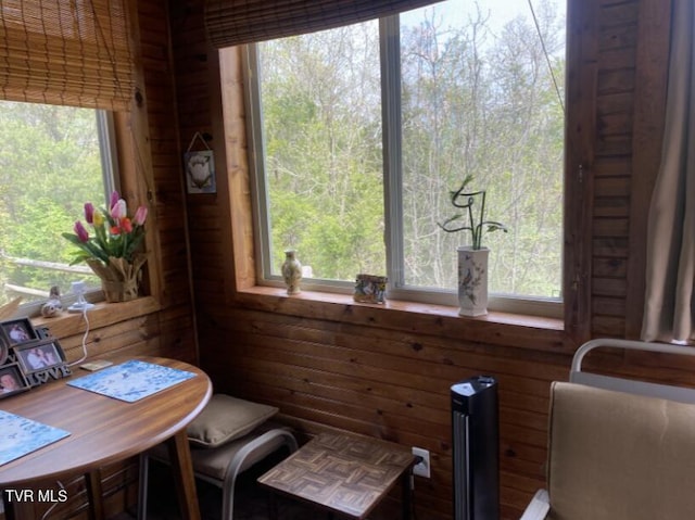 405 Coldwater Dr Unit 405, Johnson City, TN 37601 - sitting room with wood walls, a wooded view, and plenty of natural light