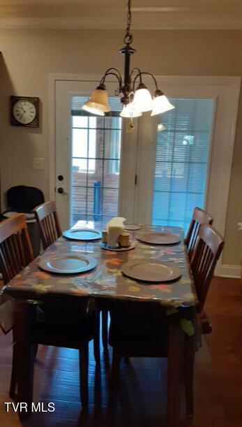 405 Coldwater Dr Unit 405, Johnson City, TN 37601 - dining area featuring ornamental molding, a chandelier, and dark wood-style flooring