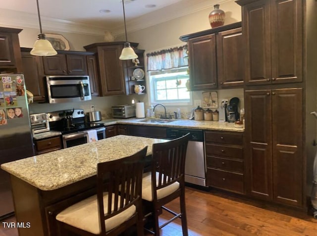 405 Coldwater Dr Unit 405, Johnson City, TN 37601 - kitchen featuring stainless steel appliances, a sink, dark brown cabinetry, light stone counters, and dark wood-style flooring