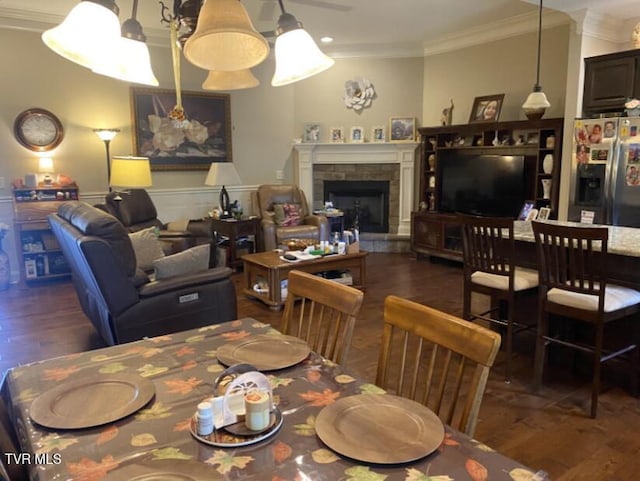 405 Coldwater Dr Unit 405, Johnson City, TN 37601 - dining space with wood finished floors, ornamental molding, a fireplace with raised hearth, and a wainscoted wall