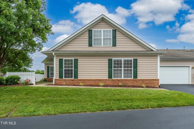 223 Avonlea Pl, Johnson City, TN 37604 - view of front of property with driveway, an attached garage, and brick siding