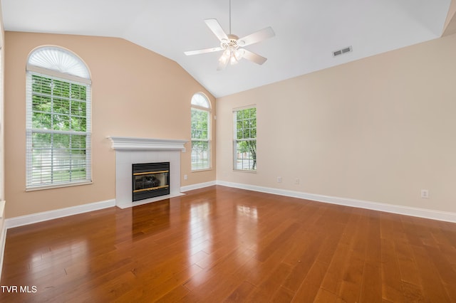223 Avonlea Pl, Johnson City, TN 37604 - unfurnished living room featuring a tiled fireplace, wood finished floors, vaulted ceiling, ceiling fan, and baseboards