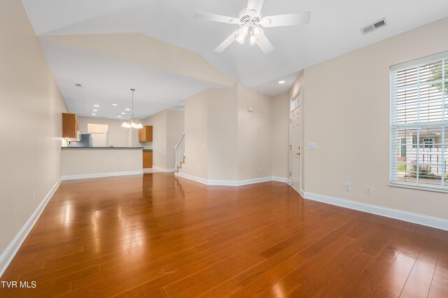 223 Avonlea Pl, Johnson City, TN 37604 - unfurnished living room with stairway, wood finished floors, lofted ceiling, a ceiling fan, and baseboards