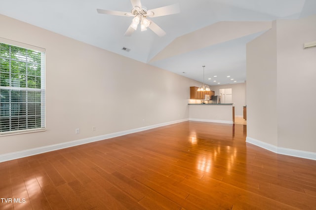 223 Avonlea Pl, Johnson City, TN 37604 - unfurnished living room with a chandelier, light wood finished floors, baseboards, lofted ceiling, and recessed lighting