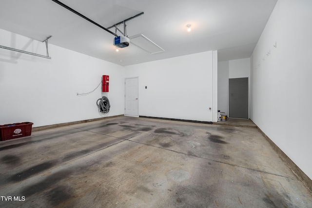 223 Avonlea Pl, Johnson City, TN 37604 - garage featuring a garage door opener and a central vacuum unit