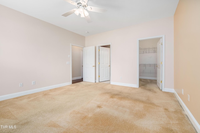 223 Avonlea Pl, Johnson City, TN 37604 - unfurnished bedroom featuring light colored carpet, a spacious closet, baseboards, a ceiling fan, and a closet