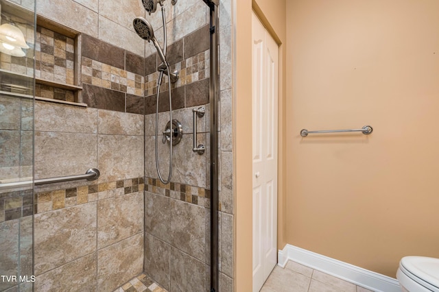 223 Avonlea Pl, Johnson City, TN 37604 - bathroom with a shower stall, toilet, baseboards, and tile patterned flooring