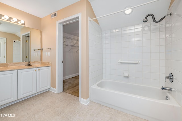 223 Avonlea Pl, Johnson City, TN 37604 - full bath featuring shower / bathtub combination, vanity, tile patterned floors, a walk in closet, and baseboards