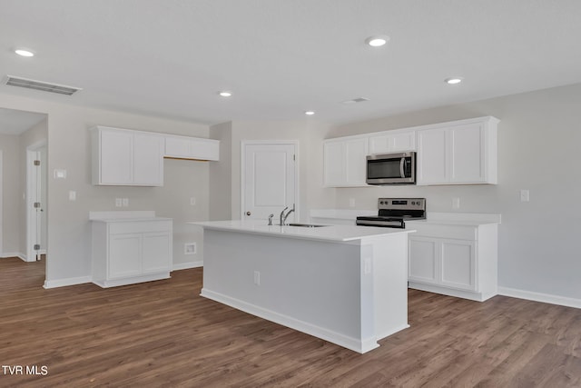 125 Crawford Cir, Bristol, TN 37620 - kitchen featuring appliances with stainless steel finishes, a sink, white cabinetry, baseboards, and recessed lighting