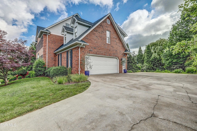 5621 John Gaines Blvd, Kingsport, TN 37664 - view of side of home with brick siding, a garage, driveway, and a yard