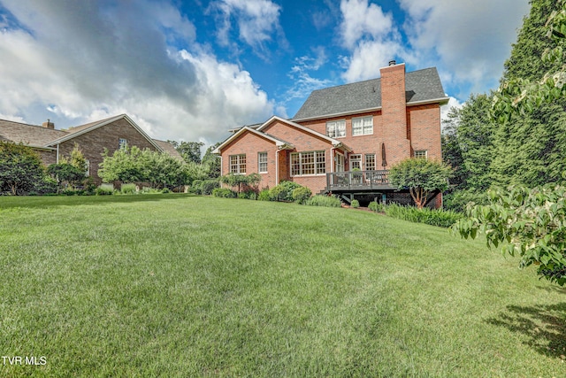 5621 John Gaines Blvd, Kingsport, TN 37664 - back of property with brick siding, a chimney, a lawn, and a wooden deck