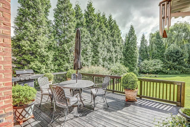 5621 John Gaines Blvd, Kingsport, TN 37664 - deck with outdoor dining space, a grill, and a lawn