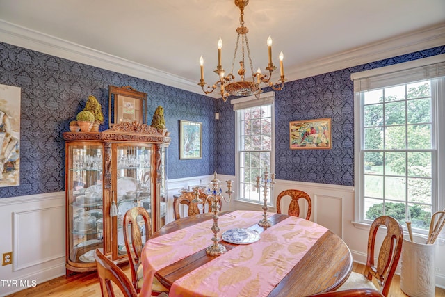 5621 John Gaines Blvd, Kingsport, TN 37664 - dining room with a chandelier, ornamental molding, wallpapered walls, a wainscoted wall, and light wood-style flooring