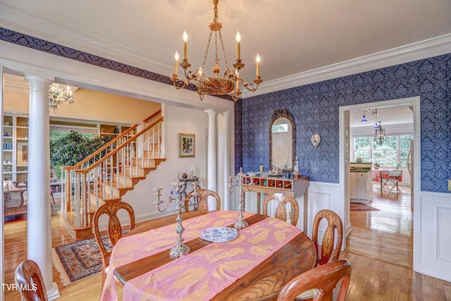 5621 John Gaines Blvd, Kingsport, TN 37664 - dining area featuring wallpapered walls, wainscoting, ornamental molding, a chandelier, and ornate columns