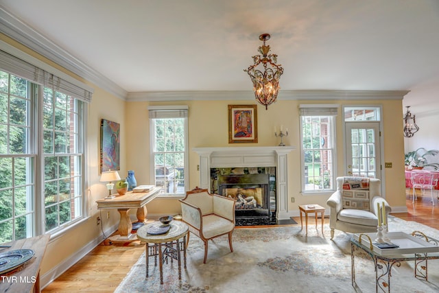 5621 John Gaines Blvd, Kingsport, TN 37664 - sitting room with baseboards, wood finished floors, a premium fireplace, crown molding, and a chandelier