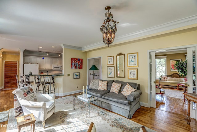 5621 John Gaines Blvd, Kingsport, TN 37664 - living room featuring ornamental molding, light wood-style floors, baseboards, and recessed lighting