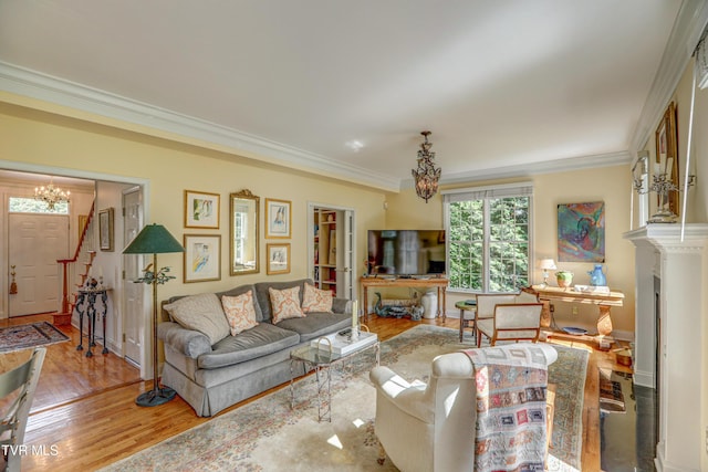 5621 John Gaines Blvd, Kingsport, TN 37664 - living room featuring a chandelier, ornamental molding, wood finished floors, baseboards, and stairs