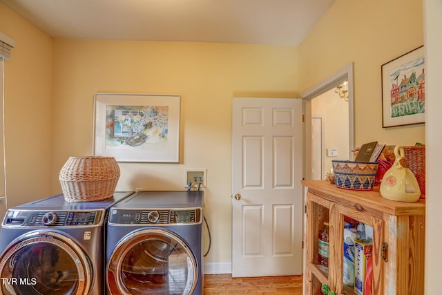 5621 John Gaines Blvd, Kingsport, TN 37664 - washroom with washer and clothes dryer and wood finished floors