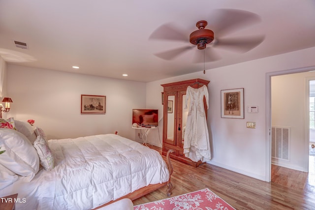 5621 John Gaines Blvd, Kingsport, TN 37664 - bedroom with wood finished floors, baseboards, ceiling fan, and recessed lighting
