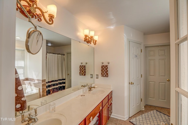 5621 John Gaines Blvd, Kingsport, TN 37664 - full bath featuring double vanity, tile patterned flooring, and baseboards