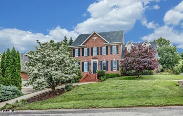 5621 John Gaines Blvd, Kingsport, TN 37664 - colonial inspired home featuring brick siding and a front lawn