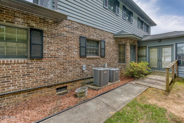 3510 Bondwood Cir, Johnson City, TN 37604 - view of side of property with french doors, cooling unit, crawl space, and brick siding