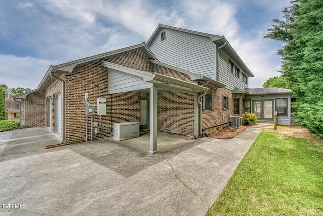 3510 Bondwood Cir, Johnson City, TN 37604 - view of side of property with brick siding, central AC, french doors, and driveway