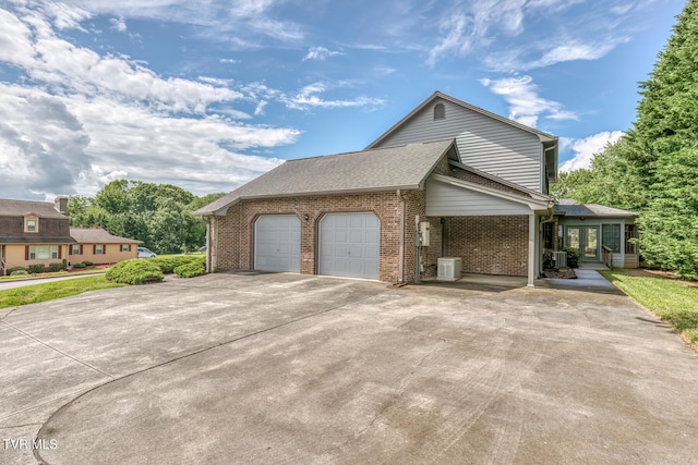 3510 Bondwood Cir, Johnson City, TN 37604 - view of side of home featuring brick siding, an attached garage, concrete driveway, roof with shingles, and central AC unit