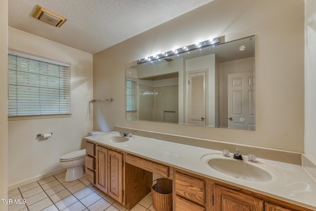 3510 Bondwood Cir, Johnson City, TN 37604 - full bathroom with double vanity, toilet, tile patterned floors, a textured ceiling, and baseboards