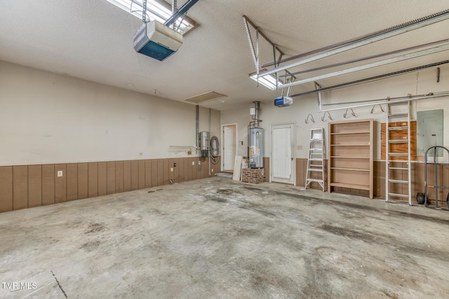 3510 Bondwood Cir, Johnson City, TN 37604 - garage featuring a garage door opener, water heater, electric panel, and wood walls