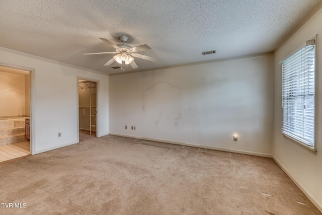 3510 Bondwood Cir, Johnson City, TN 37604 - unfurnished bedroom featuring carpet floors, a textured ceiling, a walk in closet, connected bathroom, and baseboards