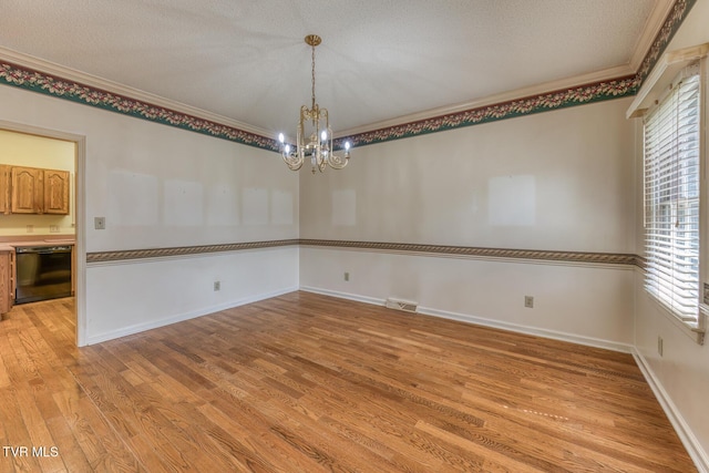 3510 Bondwood Cir, Johnson City, TN 37604 - spare room with ornamental molding, light wood-type flooring, plenty of natural light, a chandelier, and baseboards