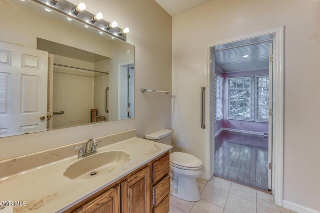 3510 Bondwood Cir, Johnson City, TN 37604 - bathroom with toilet, vanity, tile patterned floors, and baseboards
