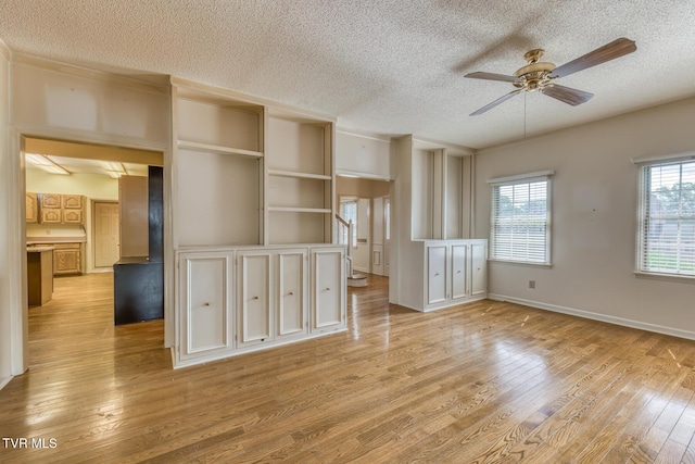 3510 Bondwood Cir, Johnson City, TN 37604 - empty room featuring a textured ceiling, ceiling fan, light wood-type flooring, and baseboards