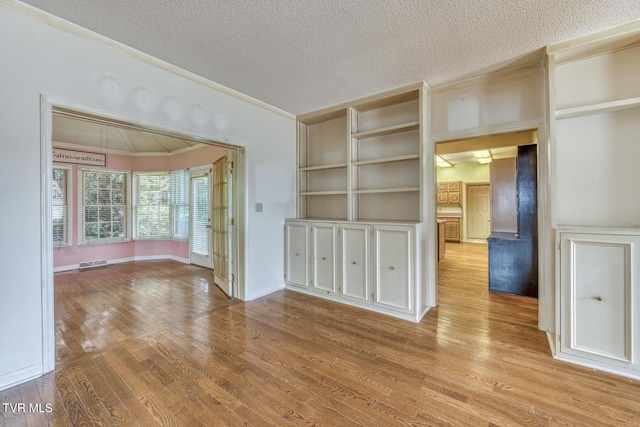 3510 Bondwood Cir, Johnson City, TN 37604 - spare room featuring wood finished floors, a textured ceiling, and crown molding