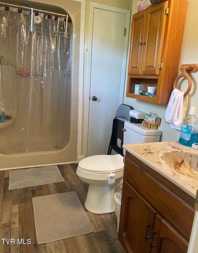 7083 Saint Clair Rd, Whitesburg, TN 37891 - bathroom with wood finished floors, toilet, and vanity