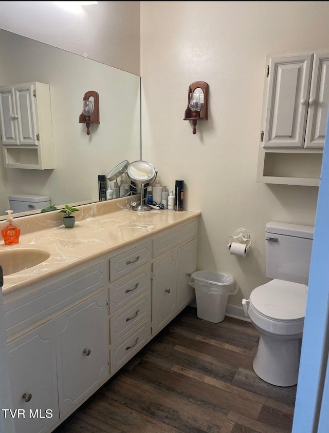 7083 Saint Clair Rd, Whitesburg, TN 37891 - bathroom with toilet, double vanity, wood finished floors, and baseboards