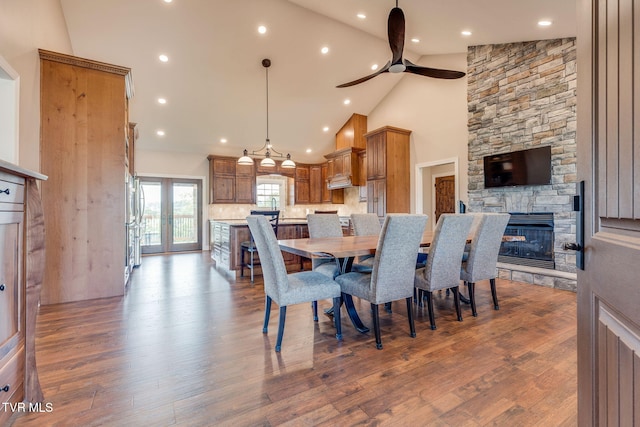 1 Sweetwood Dr, Johnson City, TN 37615 - dining room featuring a stone fireplace, a ceiling fan, wood finished floors, recessed lighting, and high vaulted ceiling