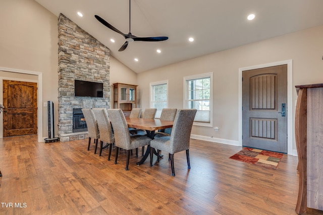 1 Sweetwood Dr, Johnson City, TN 37615 - dining area with ceiling fan, wood finished floors, a stone fireplace, baseboards, and high vaulted ceiling